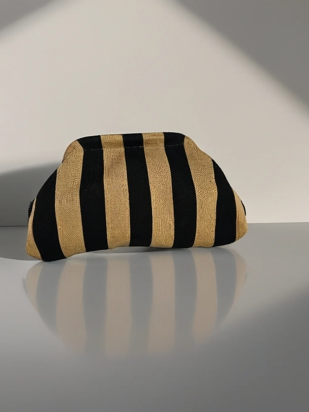 Striped Clutch Bag in Black and Ttan